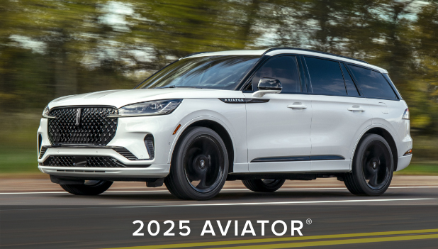 A 2025 Aviator is being driven on the road.